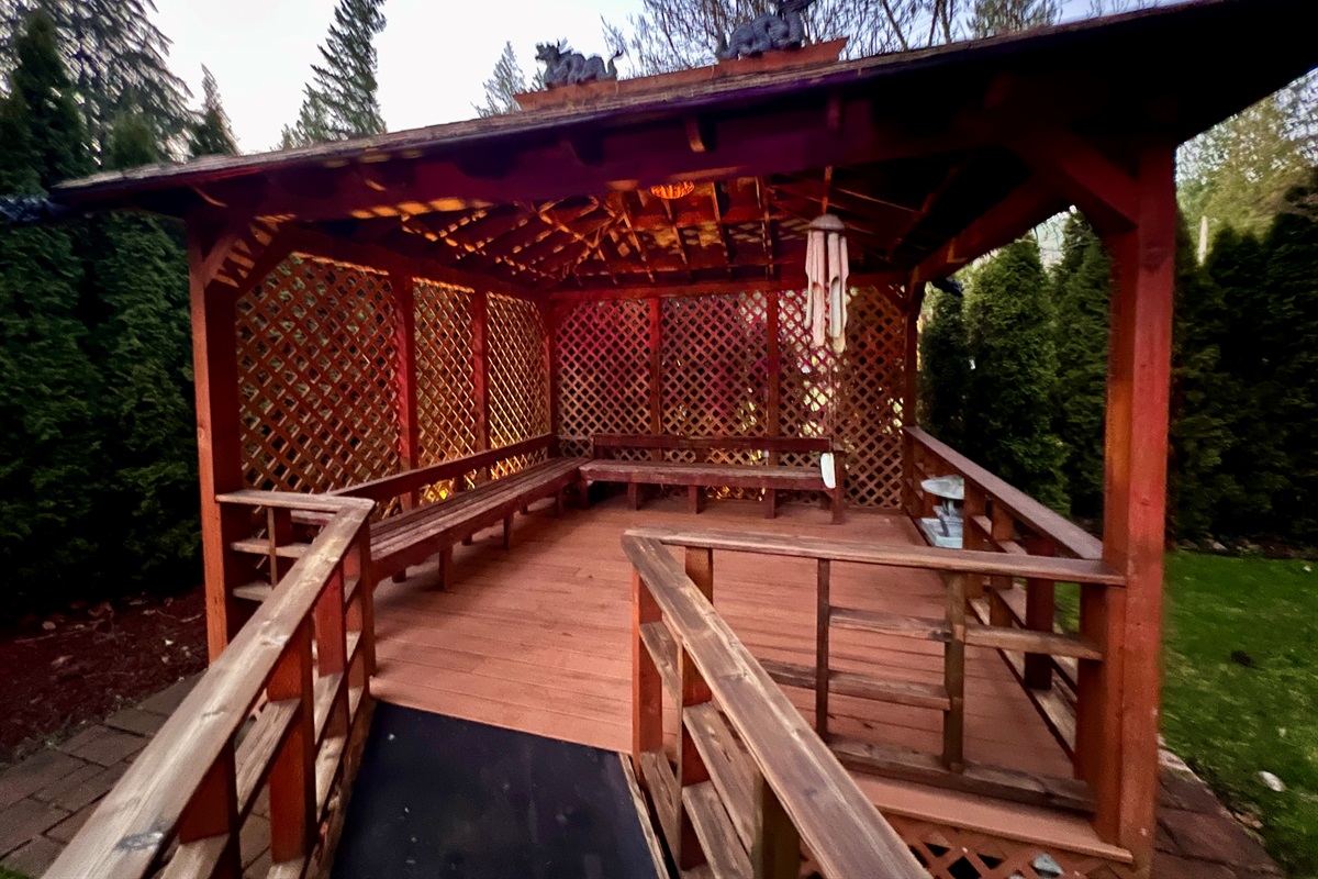 This 12’x12’ pavillion is tucked into the corner of the property and is a surrounded by maple trees and various bushes making for a peaceful space for yoga or meditation. It's ADA accessible and is next to a large grassy area to soak up the warm sunny days