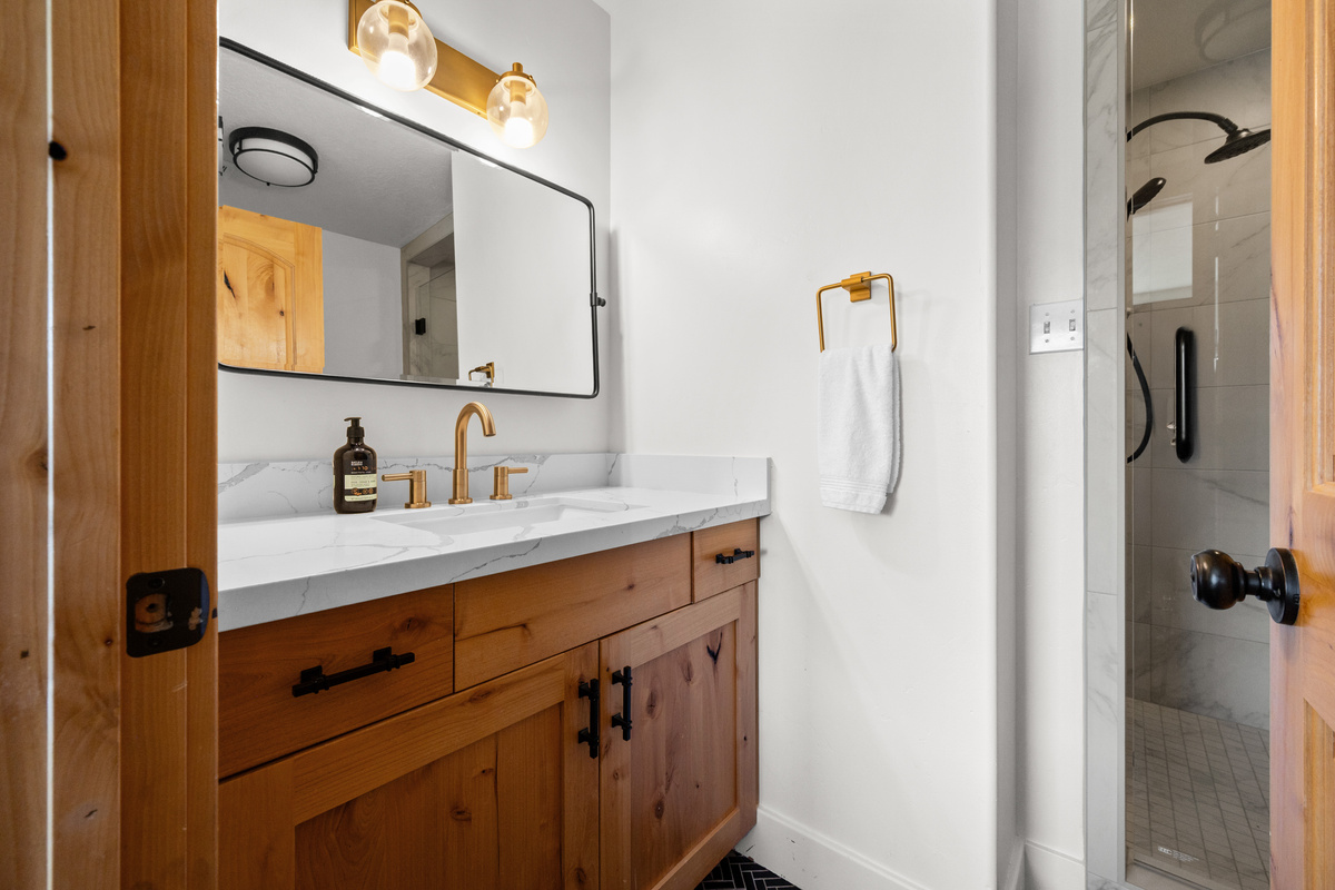 The spacious primary ensuite offers plenty of counter space for an easy morning routine.