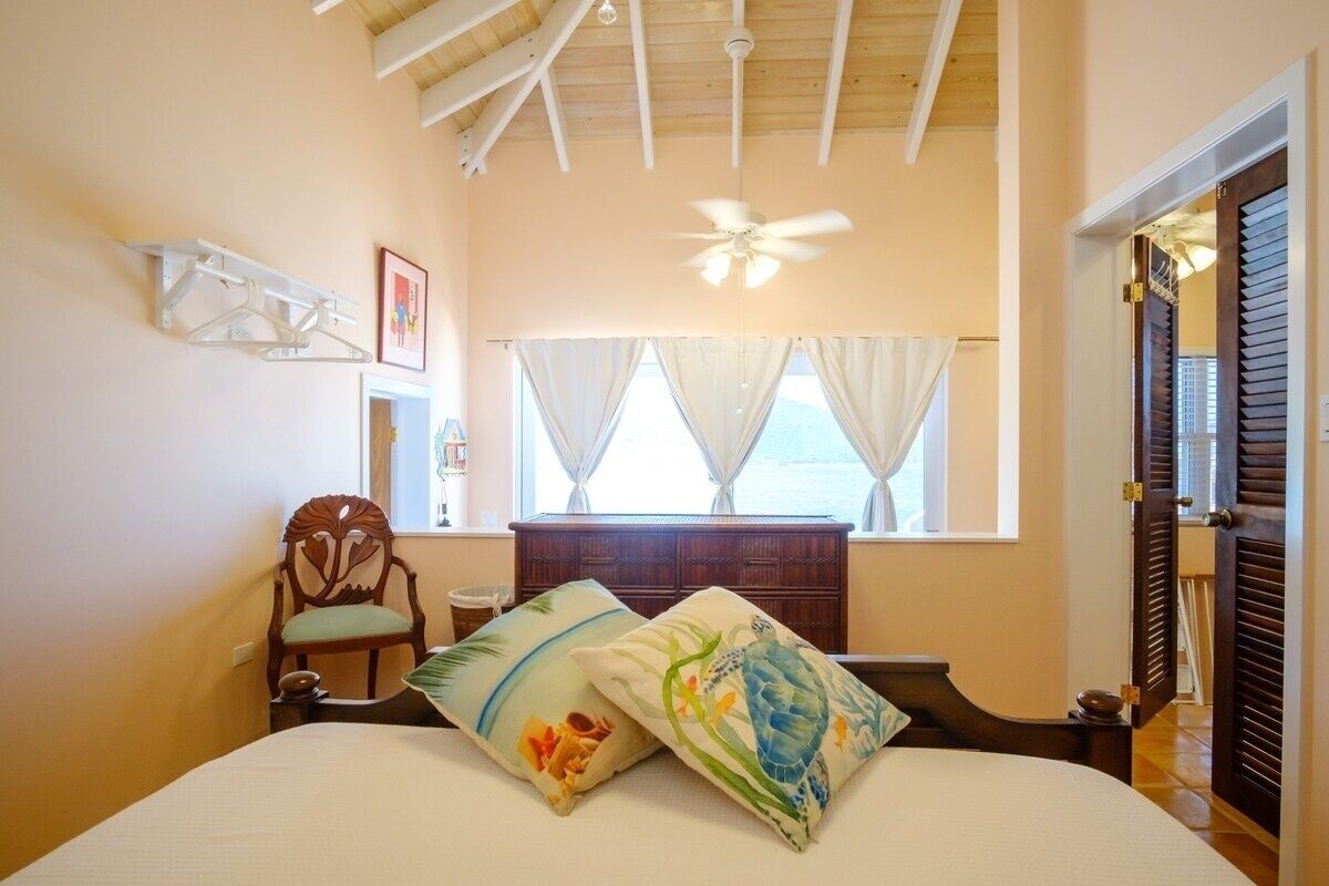 The bedroom is open and overlooks a pair of sliders that lead to another balcony. Please note this means that getting the room to below 73-75 degrees will be impossible.