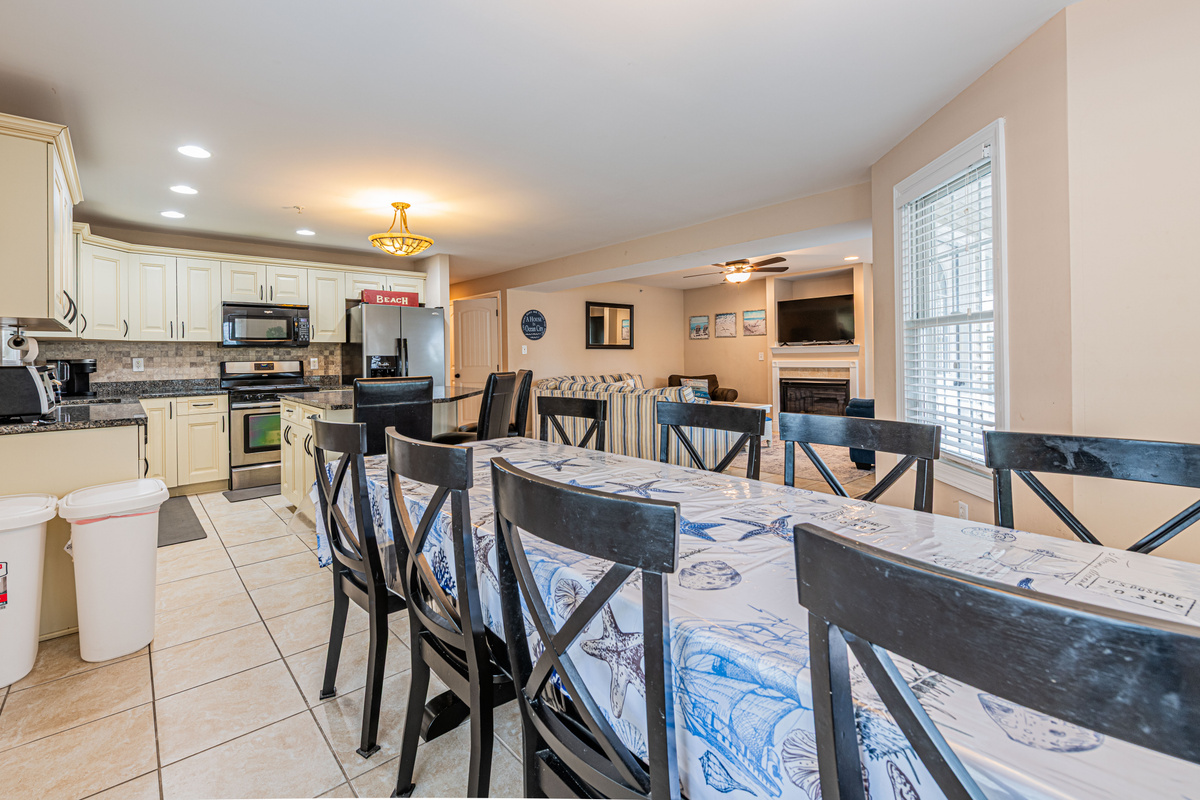 Wide View of Open Main Living, Kitchen, and Dining Spaces