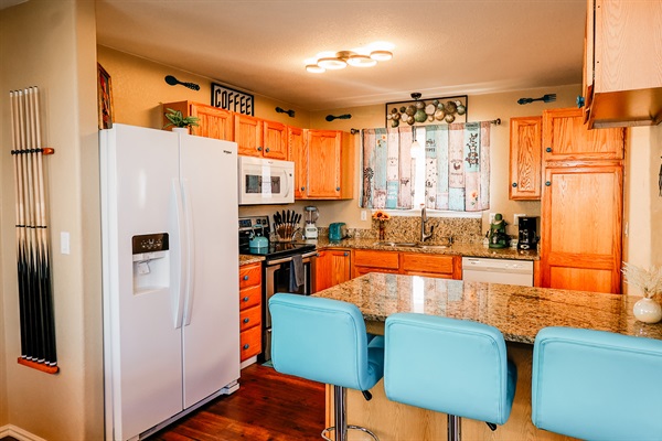 Cook Up a Storm! 🍴🔥 – Discover your inner chef in our well-stocked kitchen, featuring utensils and kitchenware. Enjoy meals with family or friends at the spacious dining table.