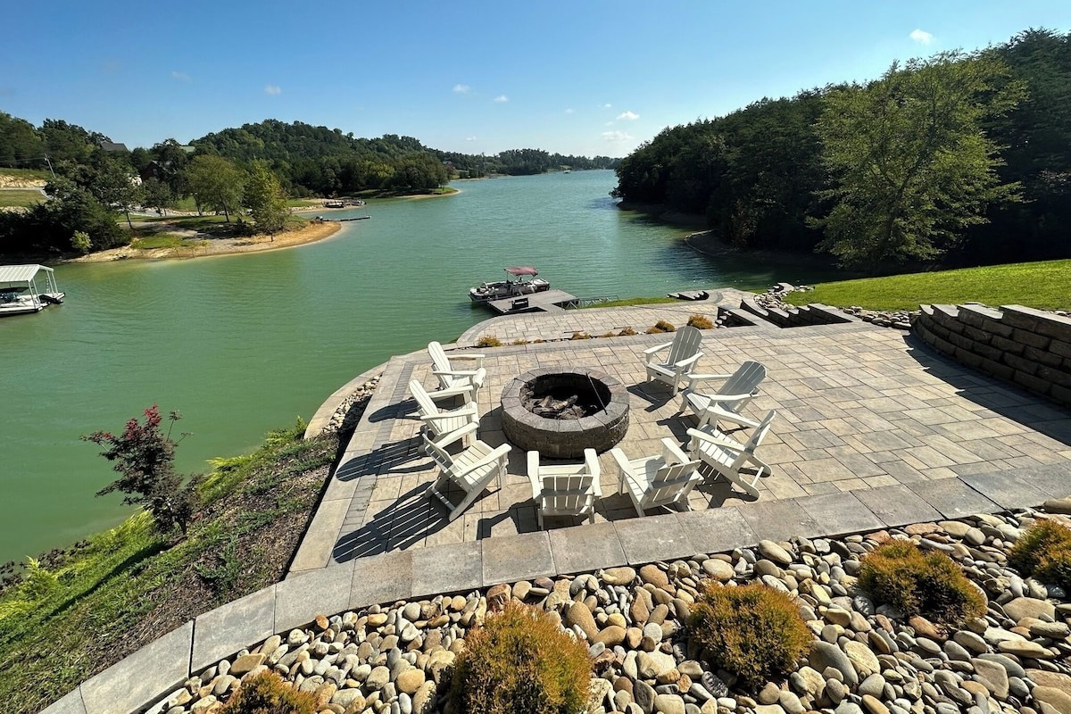 Looking down from the top outdoor kitchen patio you see the very large firepit with lots of chairs and lots of space for spreading out and enjoying an open fire with all the free firewood you want close to the firepit