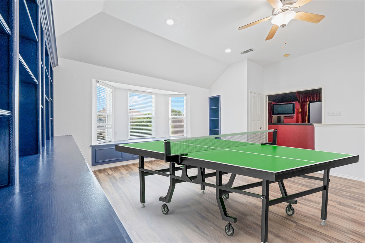 Upstairs entertainment lounge featuring a full-size ping pong table- perfect for group fun and team bonding.