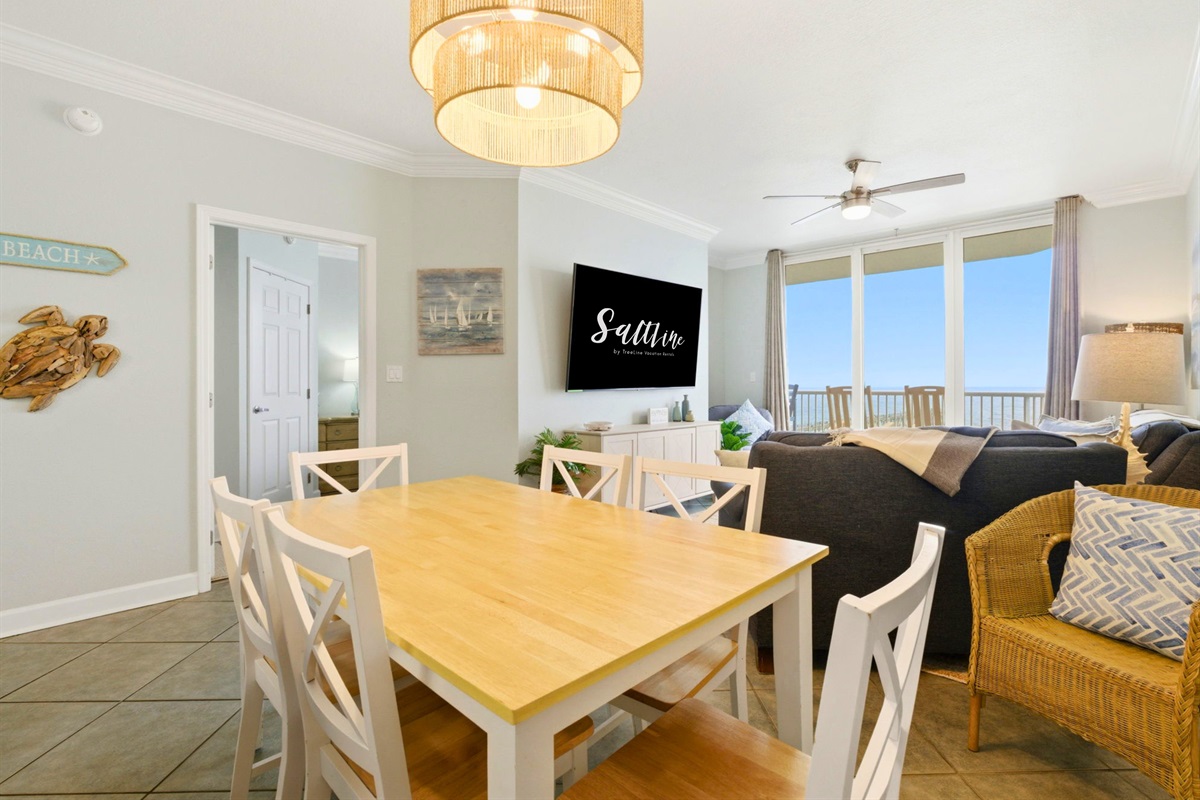 Gather around the dining table for family meals, card games, or planning tomorrow's beach adventures.