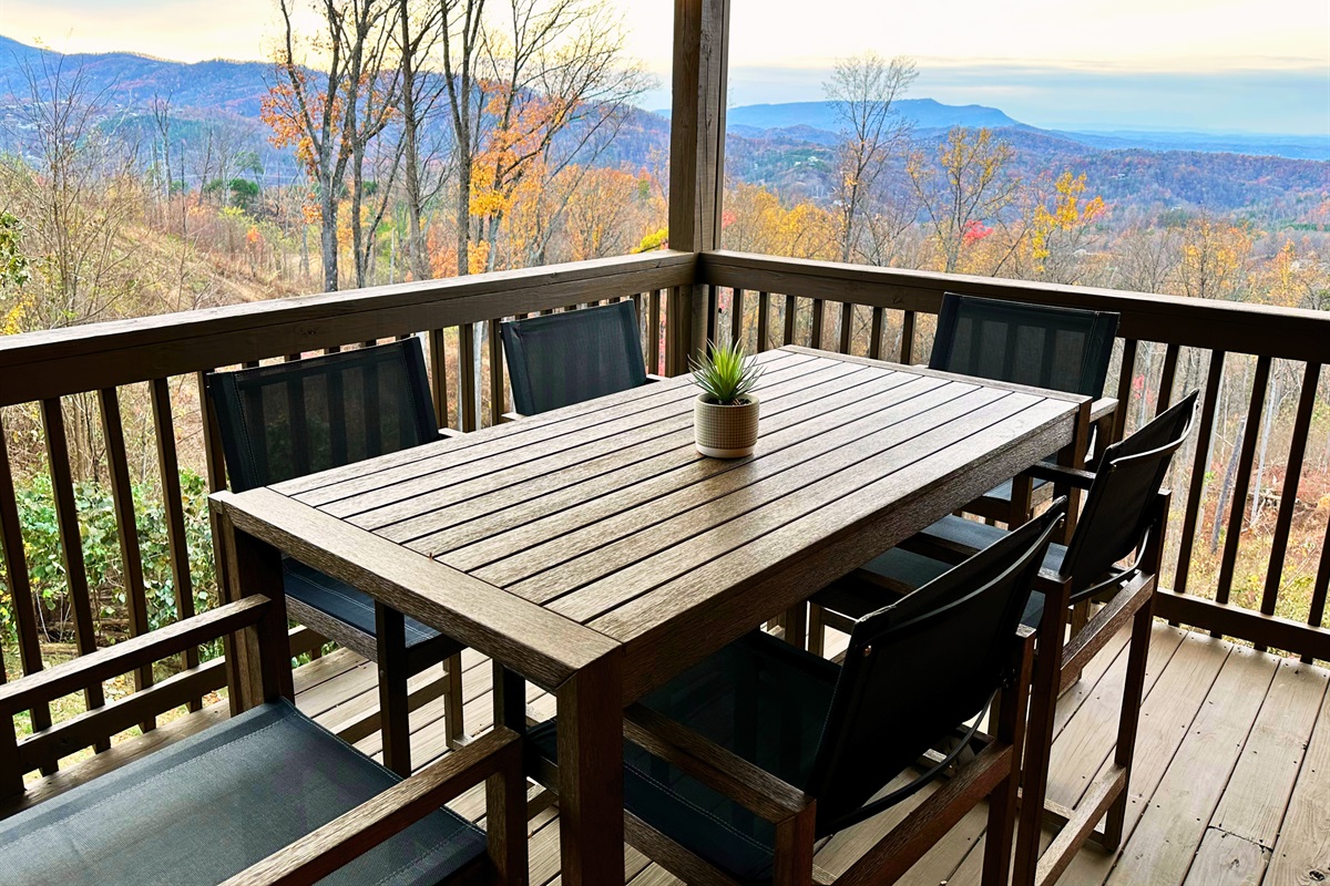 Experience the beauty of the sunset from the lower deck at Signature Stay, the perfect way to end your day with stunning mountain views