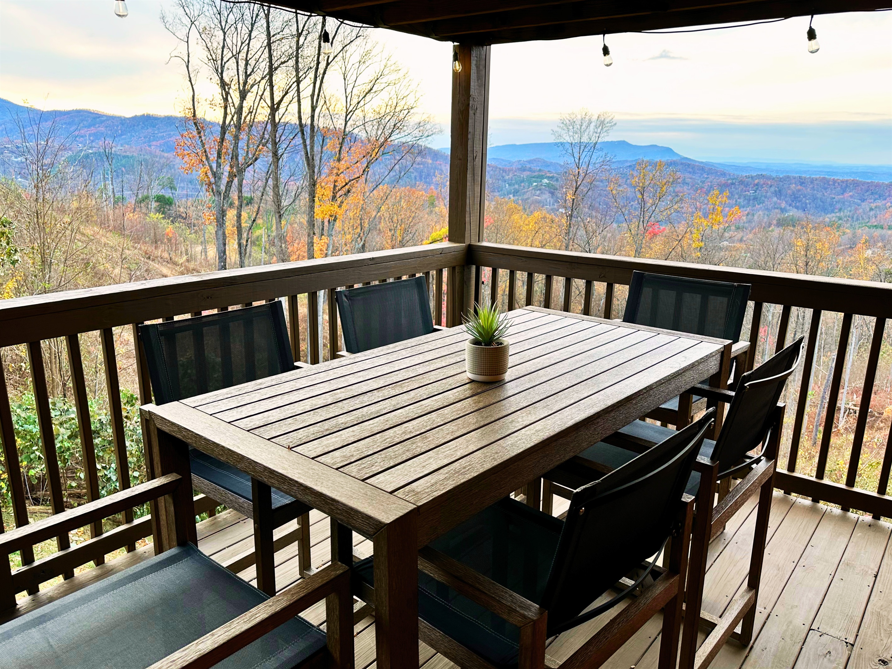 Experience the beauty of the sunset from the lower deck at Signature Stay, the perfect way to end your day with stunning mountain views