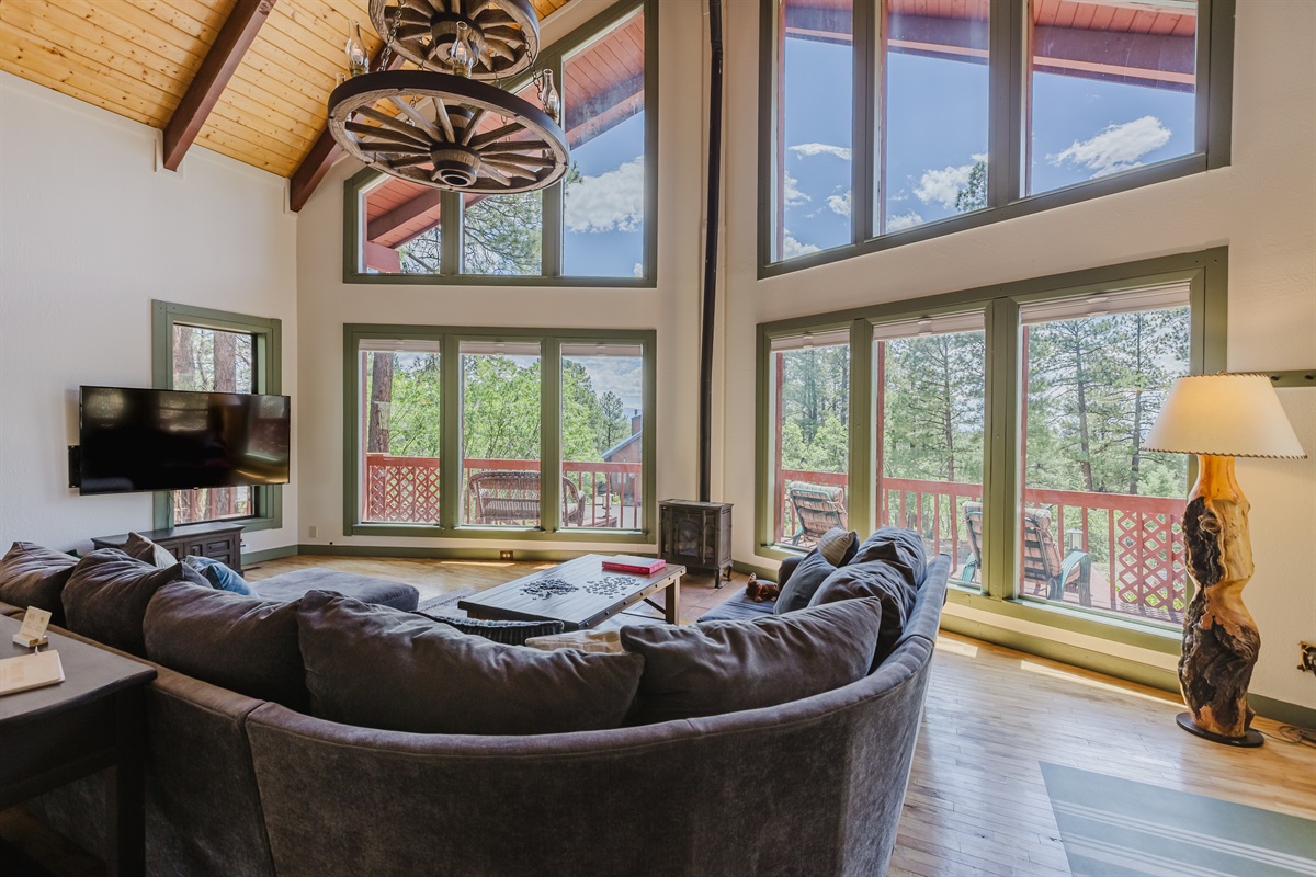 The living room designed to blend comfort with the surrounding landscape.