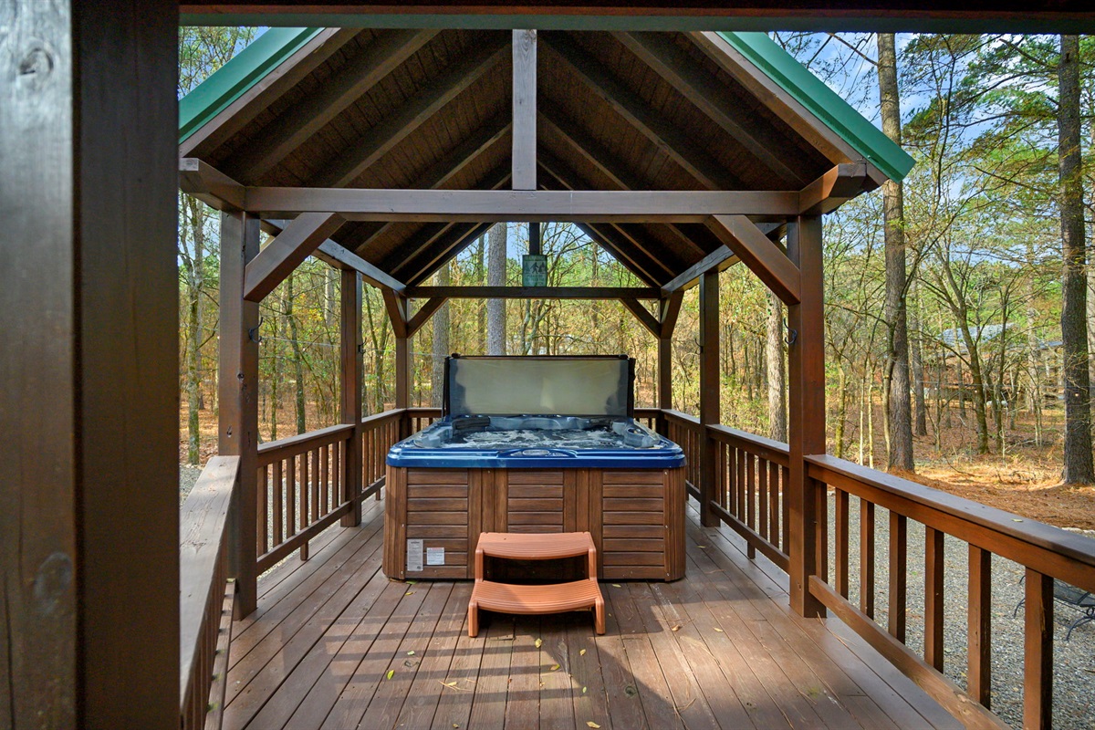 Covered hot tub to enjoy rain or shine.