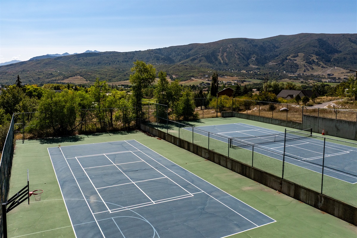 Tennis courts with mountain backdrop – great for summer recreation.