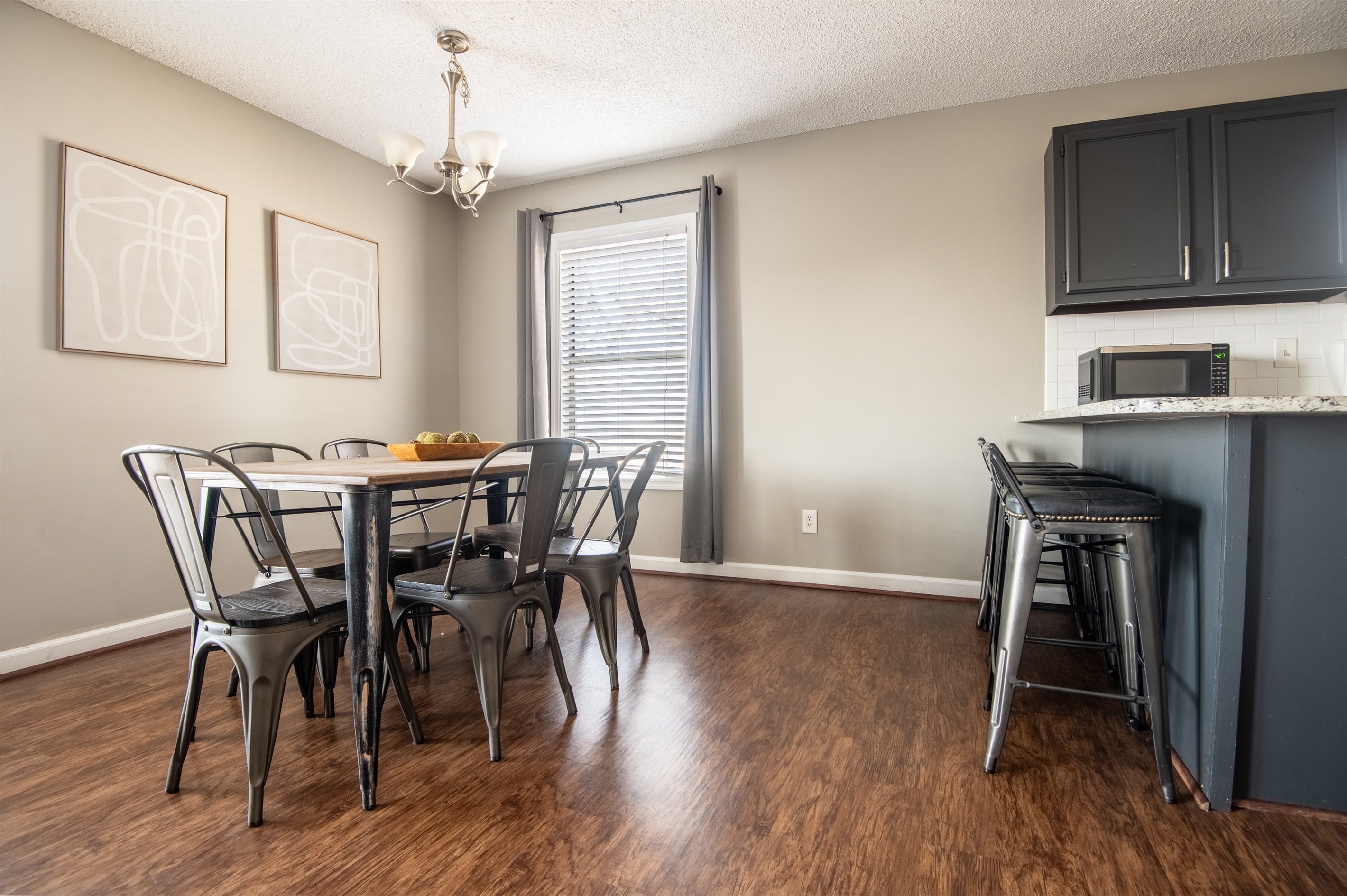 There is plenty of seating in the dining area with both the dining table and the bar seating!