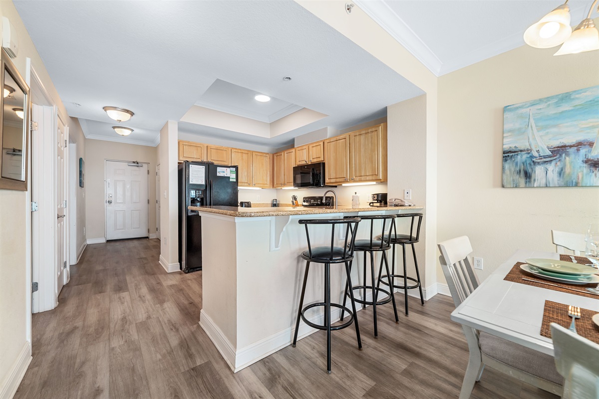 Gather, eat, and make memories. Our spacious dining area and adjacent breakfast bar provide plenty of room for guests to enjoy meals and conversations, creating the perfect setting for your vacation.