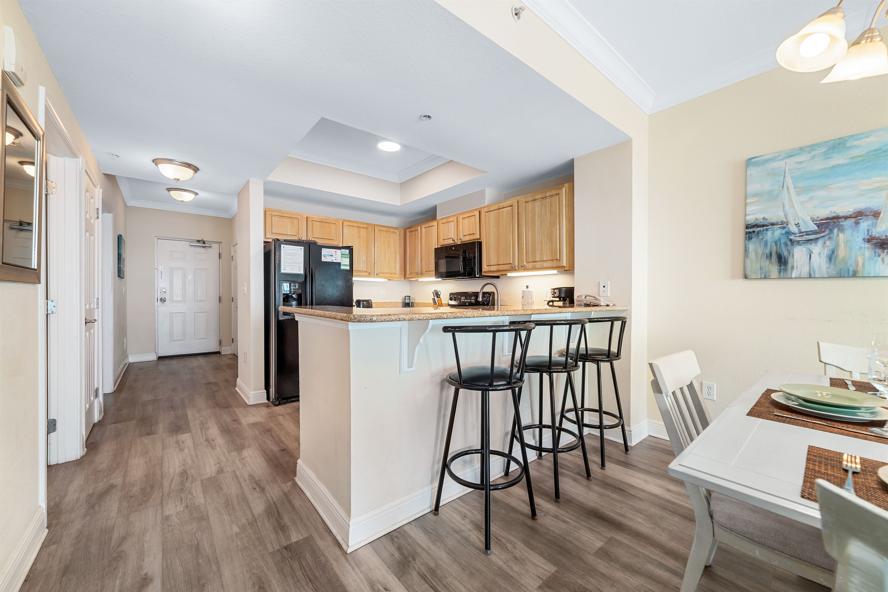 Gather, eat, and make memories. Our spacious dining area and adjacent breakfast bar provide plenty of room for guests to enjoy meals and conversations, creating the perfect setting for your vacation.