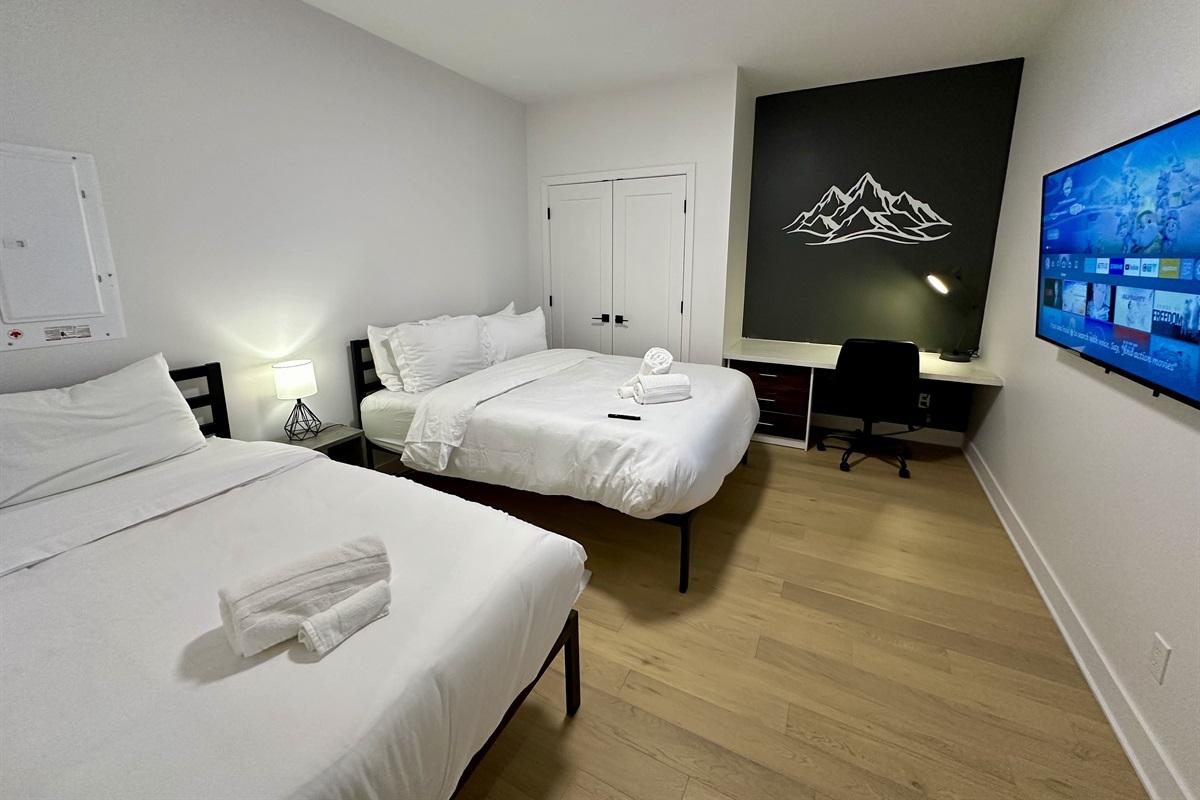 2nd Bedroom with 50&rdquo; Smart TV and dedicated workspace