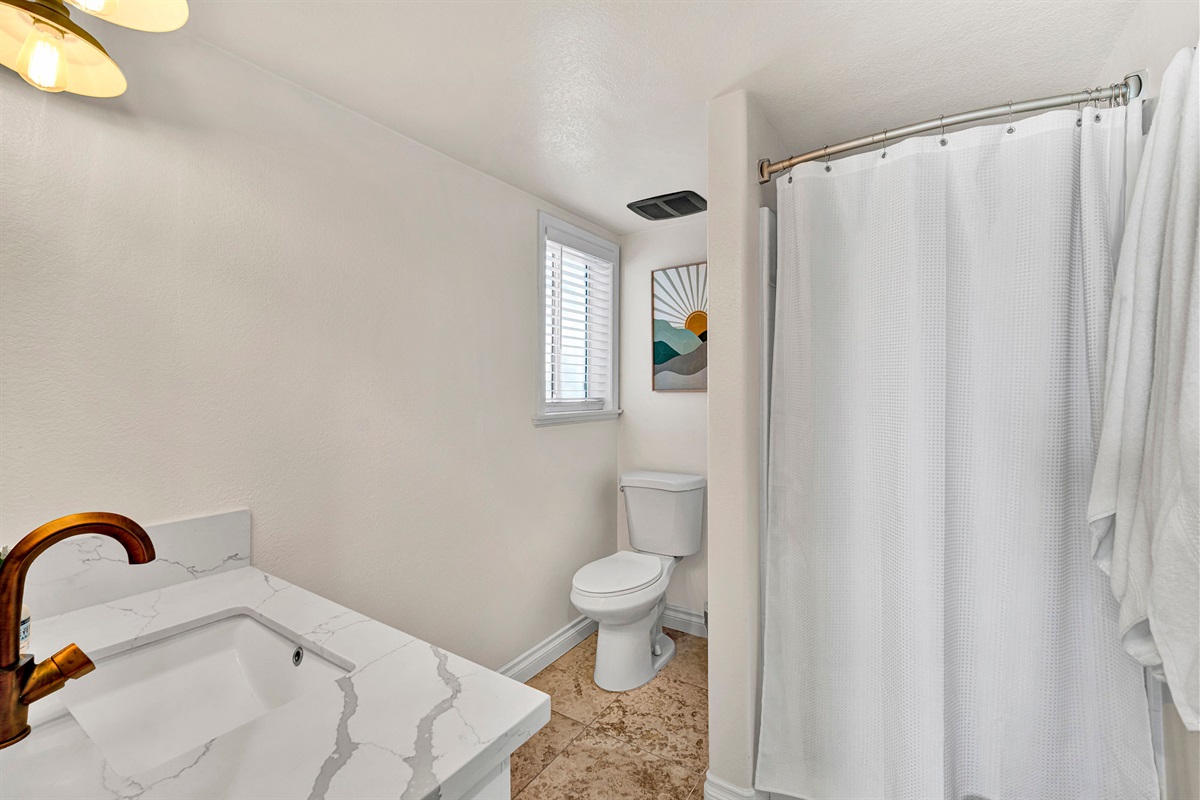 Spacious guest bathrooms stocked and ready — comfort and convenience for every guest
