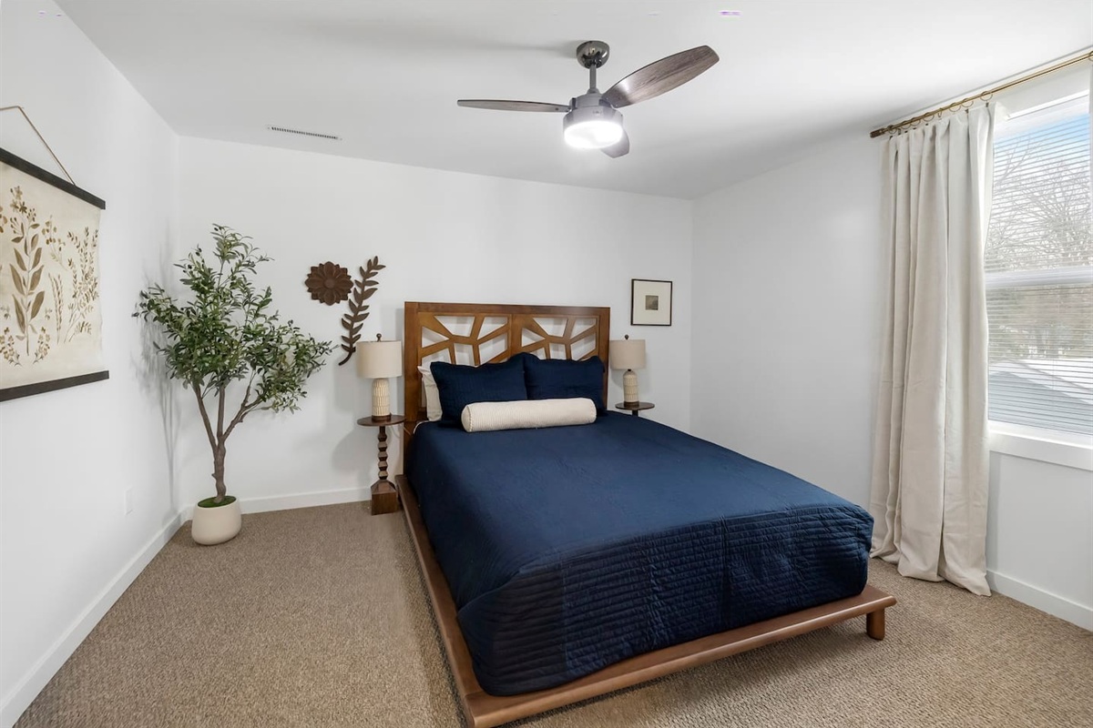 Queen-sized bed in one of the upstairs bedrooms. 