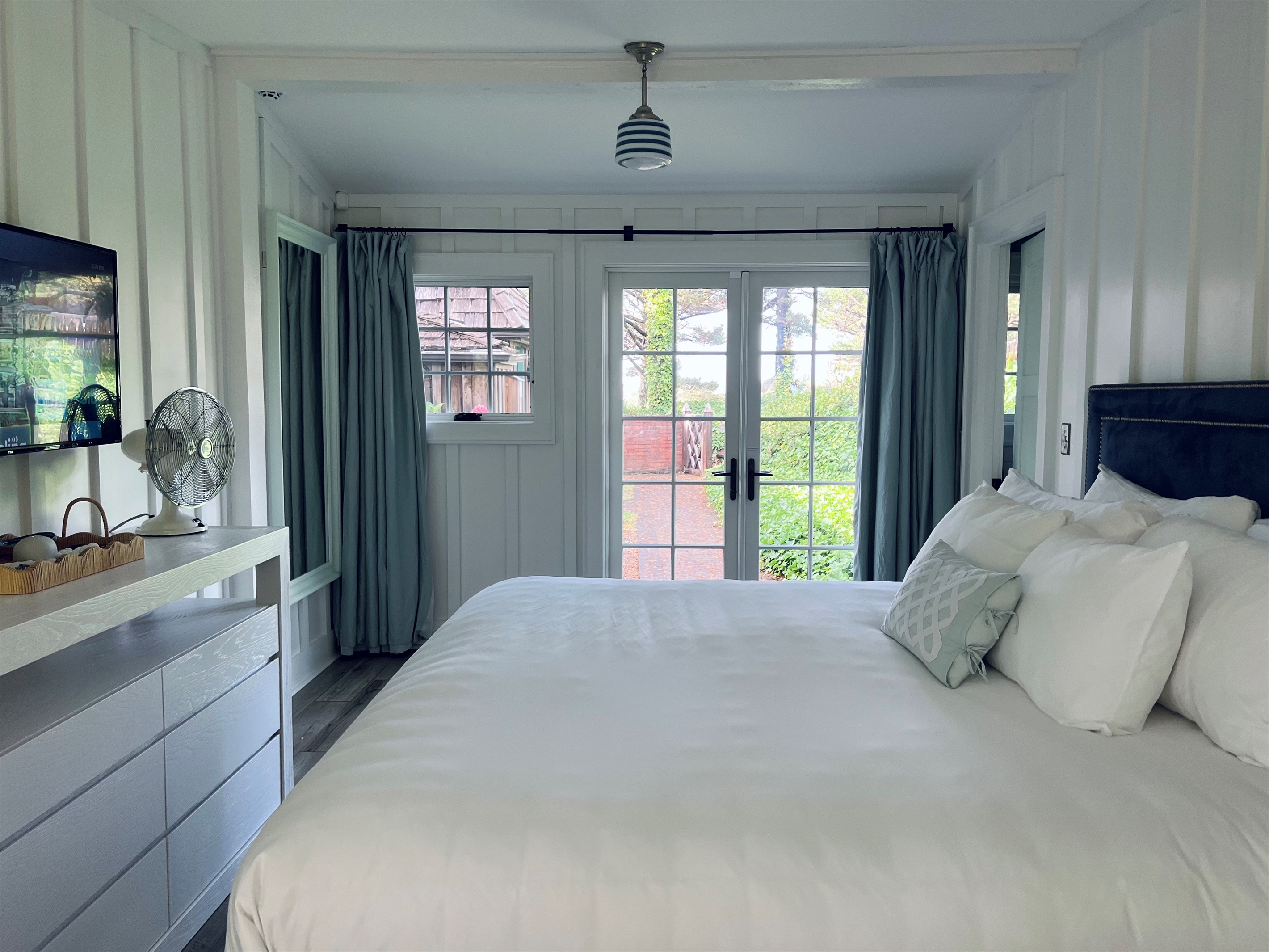 PRIMARY BEDROOM - double doors to front patio (pro photos coming soon)