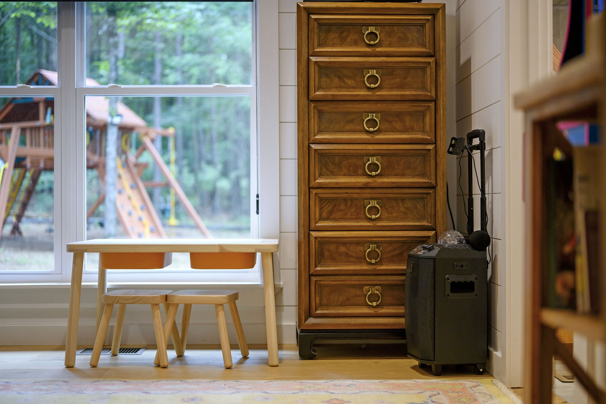 The stylish bunkroom features four twin beds, a karaoke machine, arcade, cozy designer touches, and high-end linens—creating a comfortable and welcoming retreat for kids or additional guests.