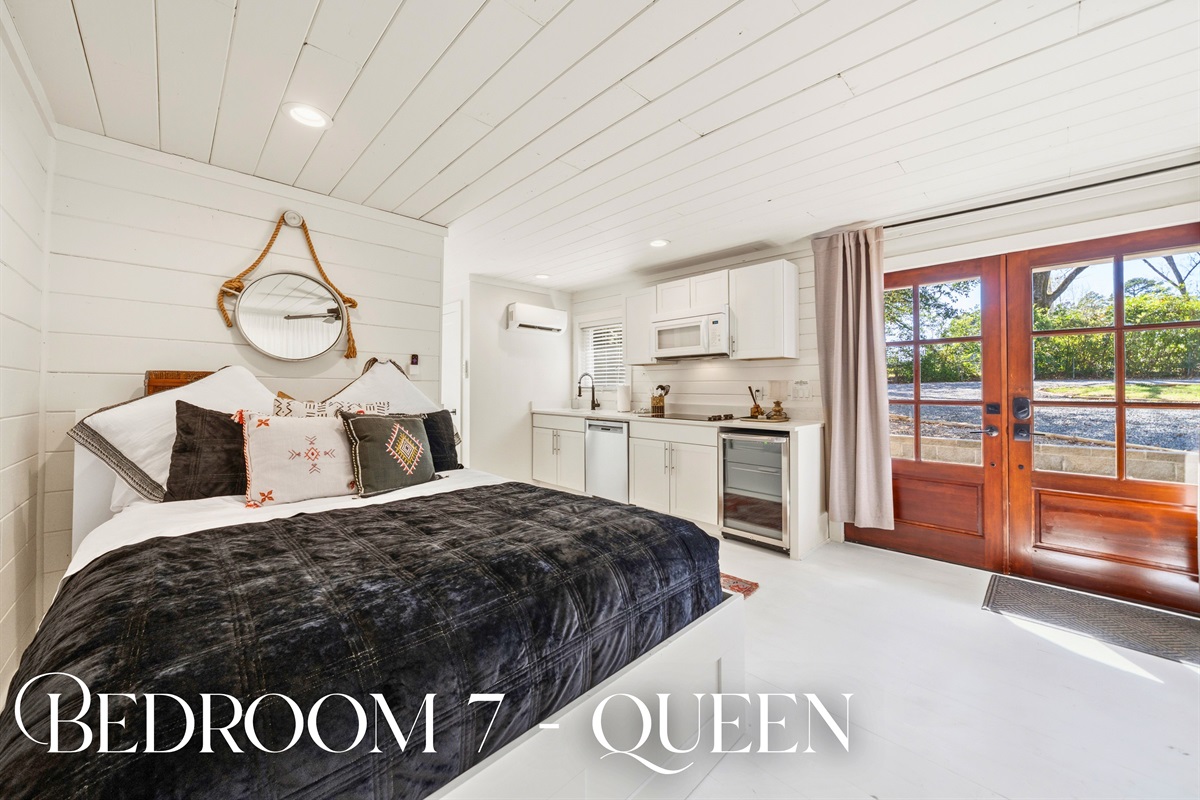 Retreat to this cabin bedroom where soft bedding and a calm, quiet atmosphere provide the perfect place to rest.