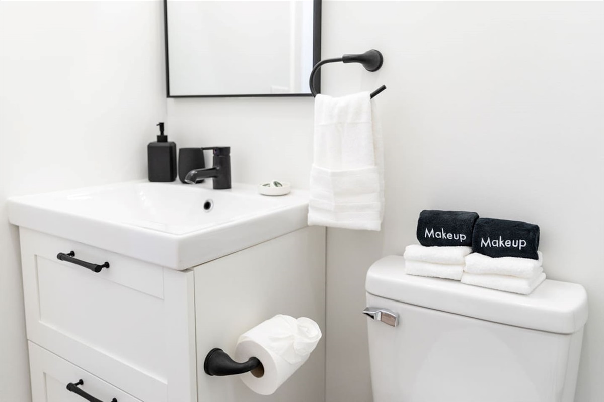Toilet with a sink, providing a clean and functional space in the bathroom.