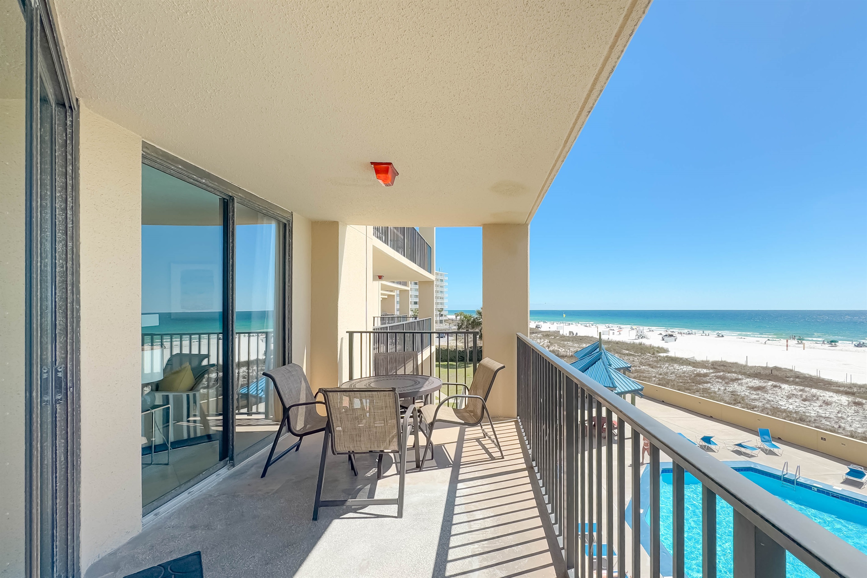 Al fresco dining with a view. This spacious private balcony features comfortable outdoor seating and a table, perfect for meals or evening cocktails.