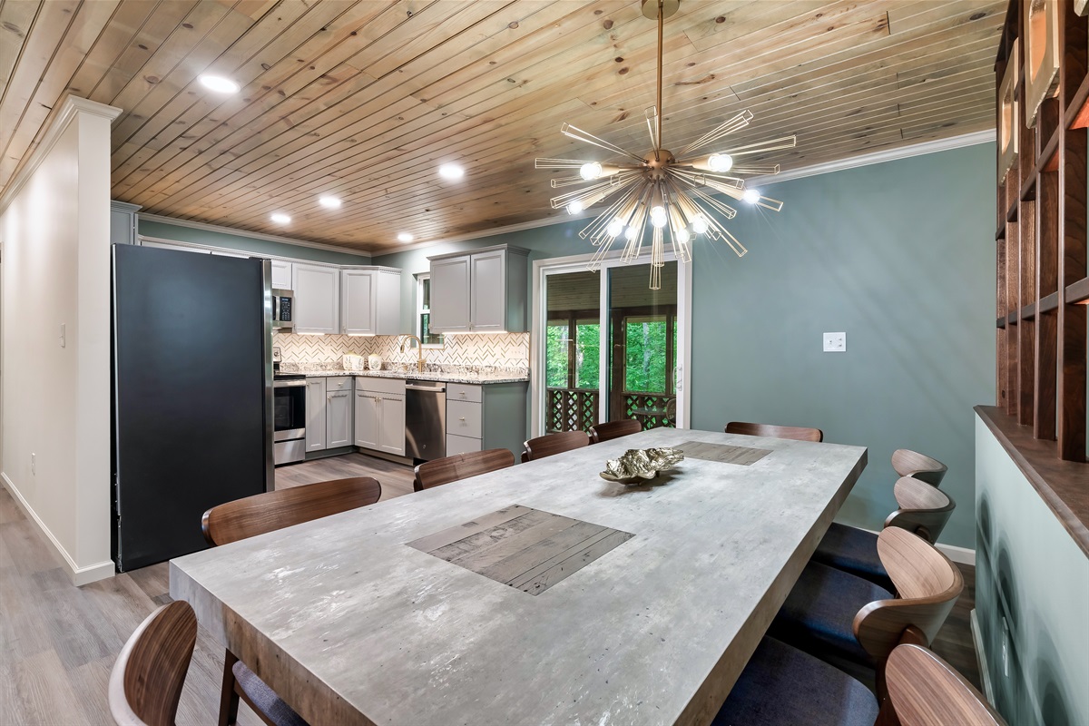 The heart of the home. Enjoy a family meal or a game night around this gorgeous concrete-style dining table. Plenty of room for all!