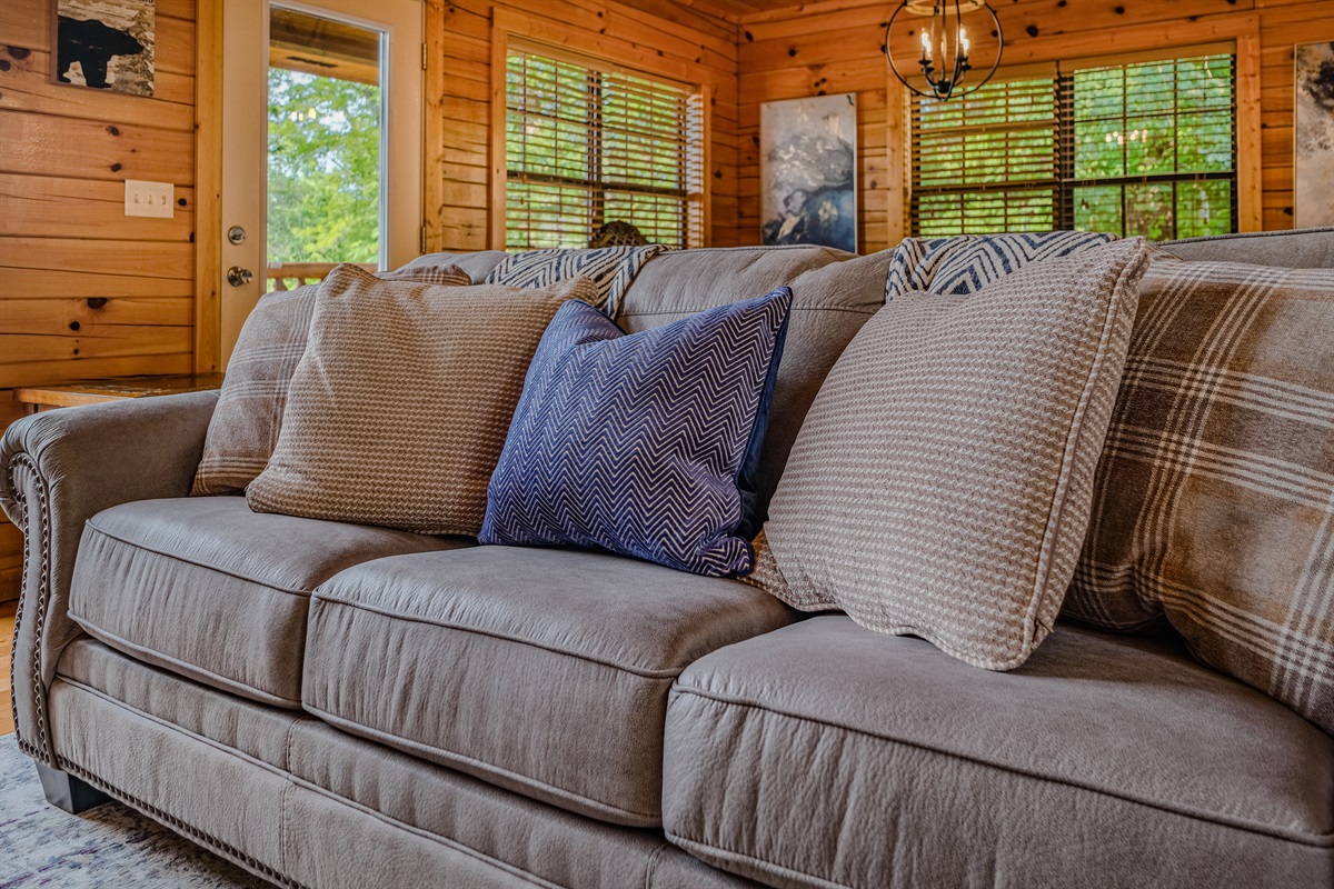 Couch in living room is a queen sleeper sofa