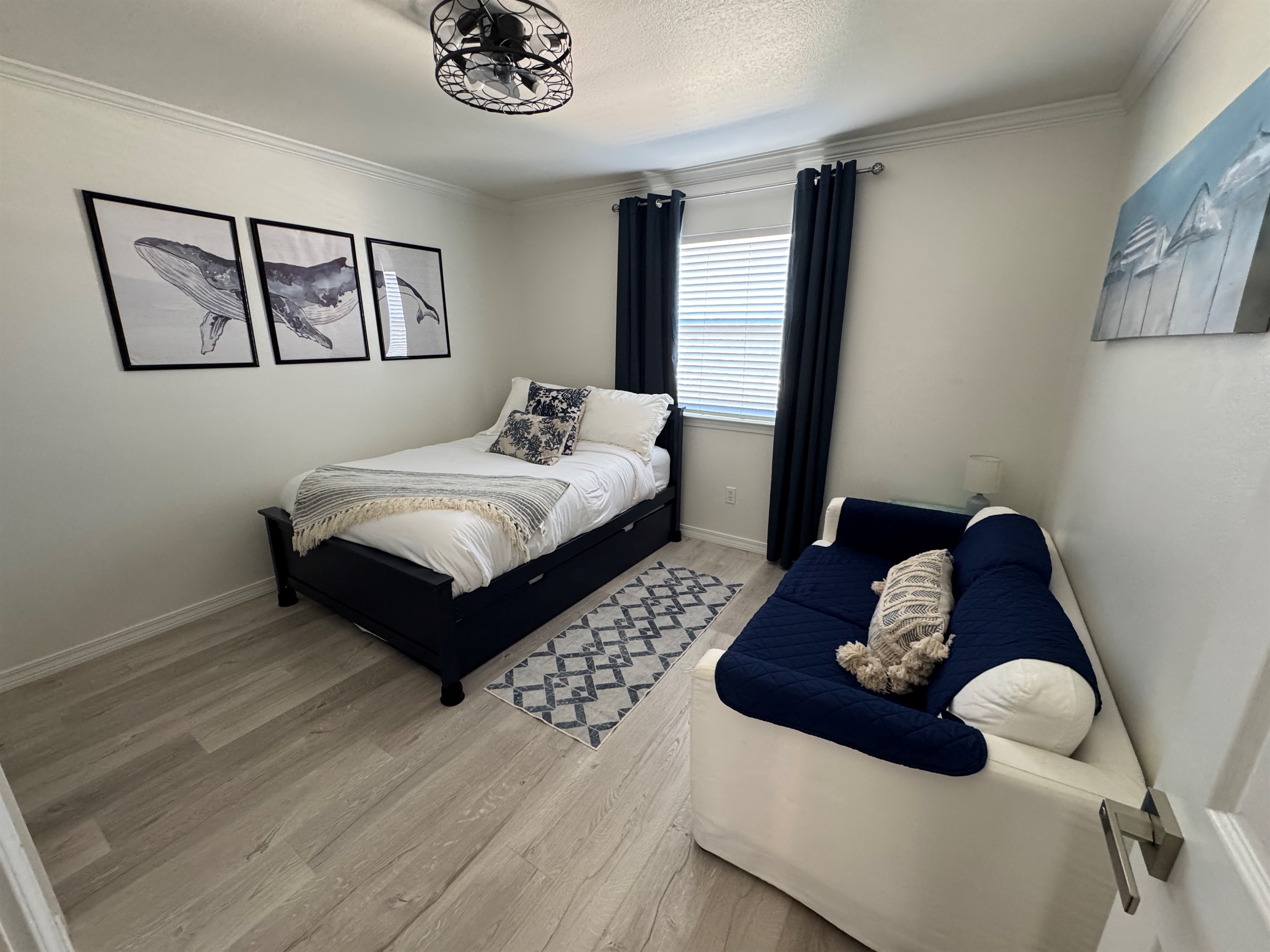 Third bedroom with full bed and trundle underneath.  Loveseat sofa as well