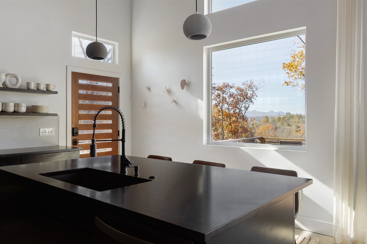 {Kitchen Views} Cook with treetop and mountain views as your everyday backdrop.