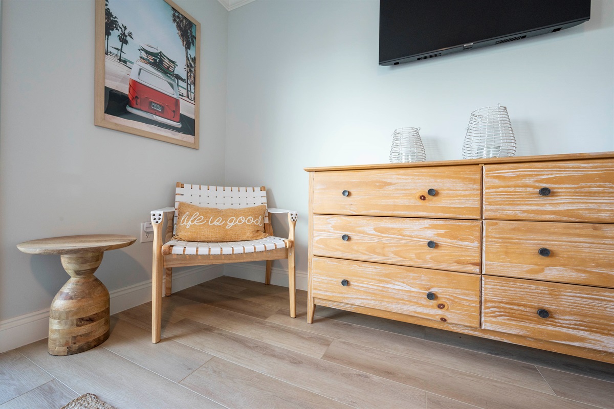 Warm vibes with wooden decor, cozy pillows, and charming wall art.