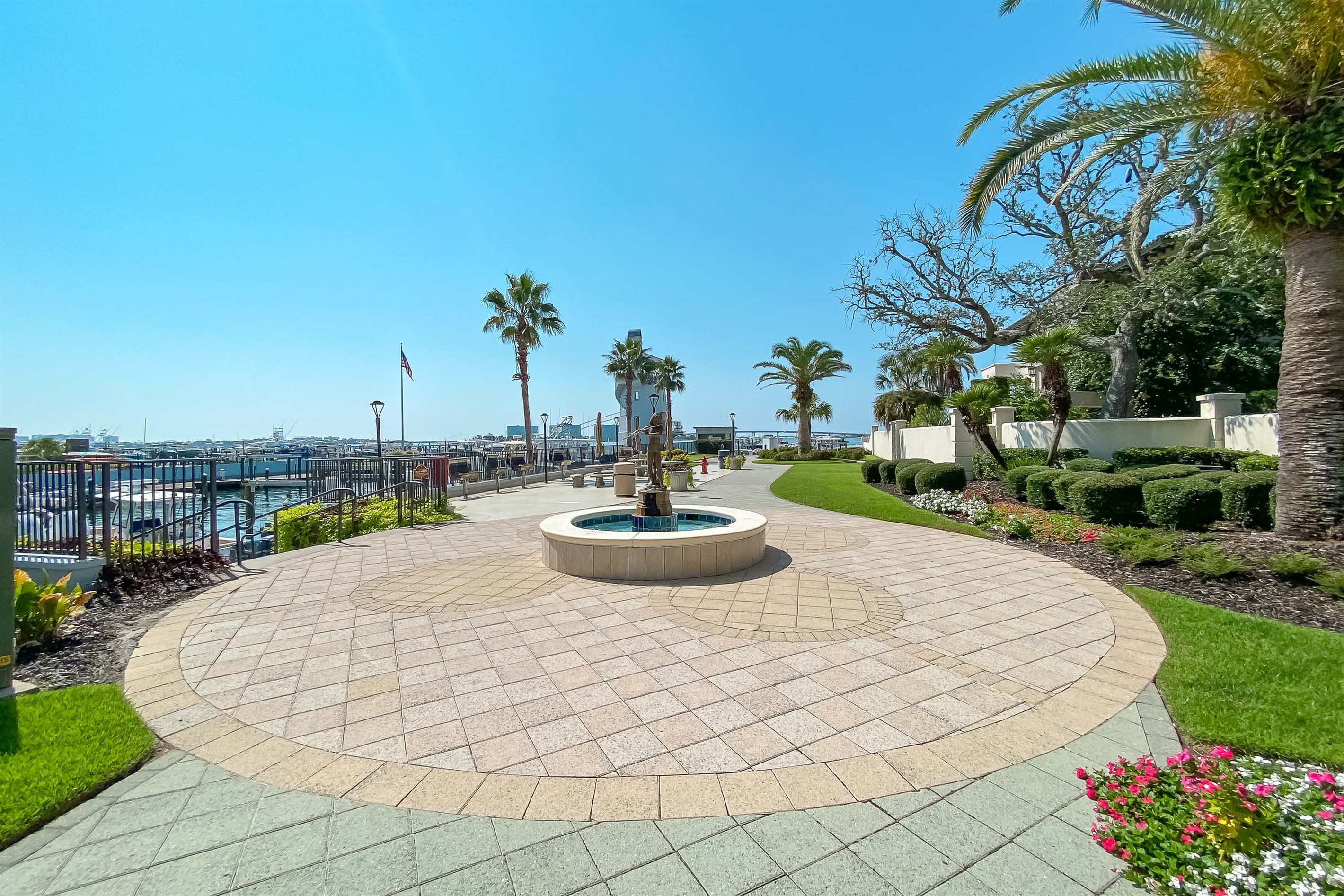 Discover a vibrant coastal lifestyle. This meticulously designed property offers residents exquisite outdoor spaces, stunning architectural details, and convenient access to the marina, making every day feel like a getaway