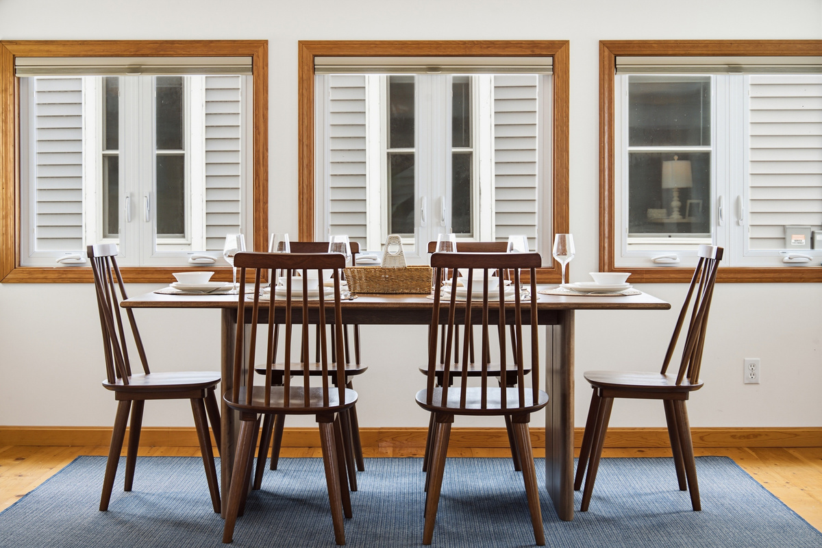 Bright and welcoming dining space with large windows and comfortable seating for everyone.
