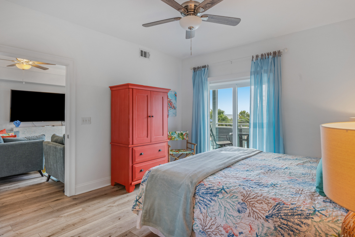 Primary bedroom; King size bed with Tempur-Pedic mattress and TV.  Bedroom has an ensuite bathroom and walk out balcony.