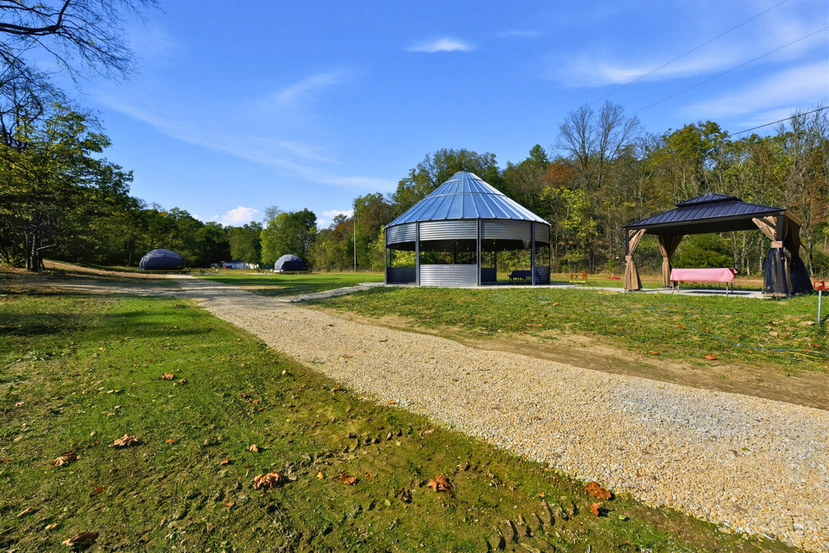 Gather with friends or family in the shared gazebo, with seating for time together outdoors.