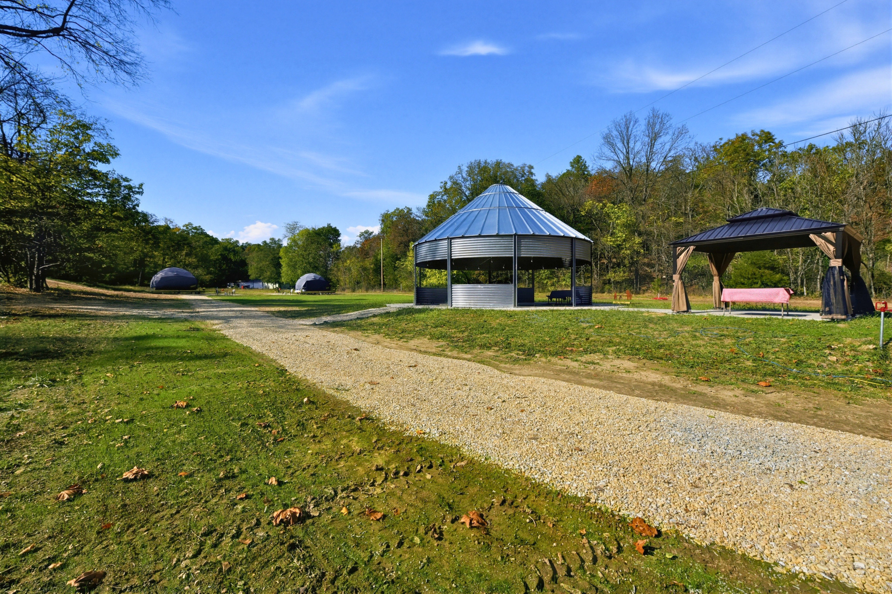 Gather with friends or family in the shared gazebo, with seating for time together outdoors.