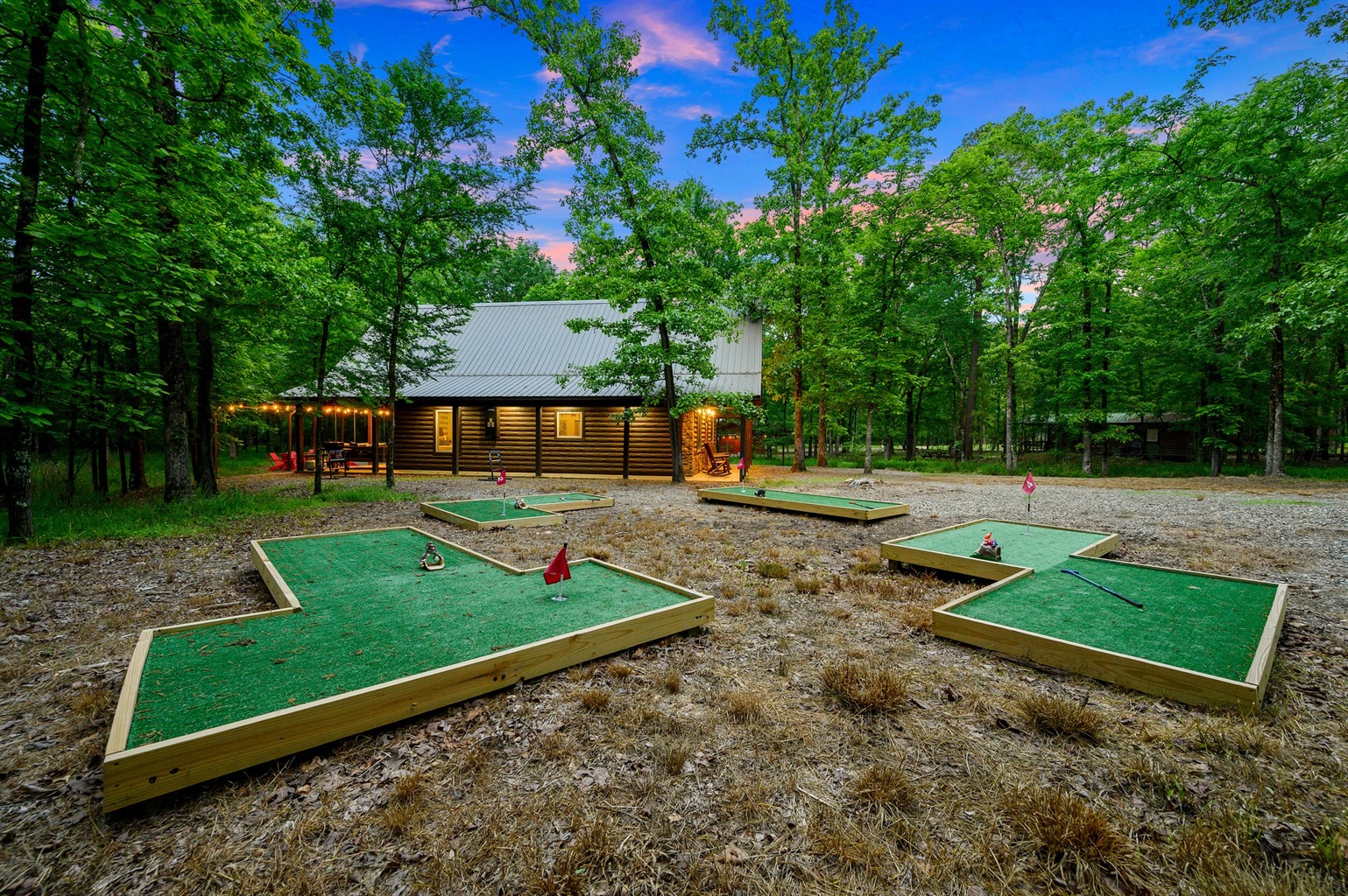 Shared mini golf course beside the neighboring sister cabin.