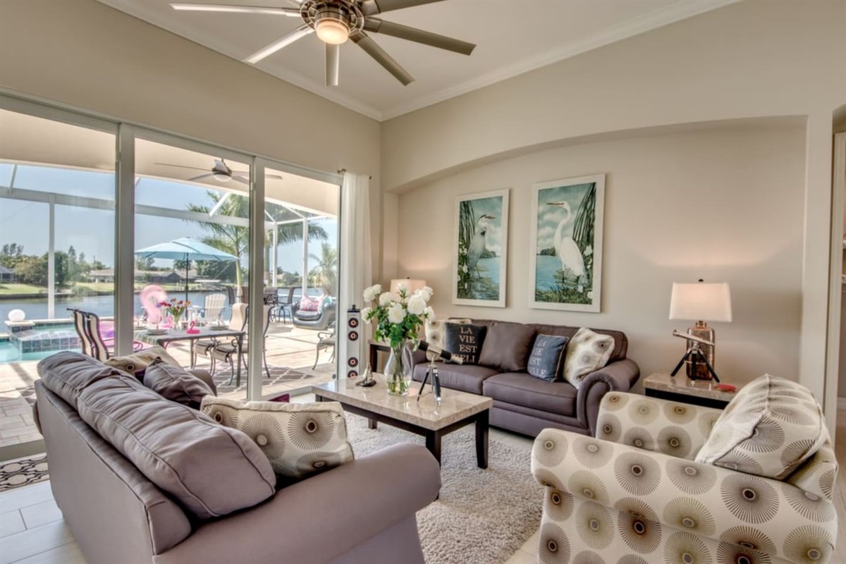 Villa Blissful Bay - Living room with a view of the Lanai and Pool
