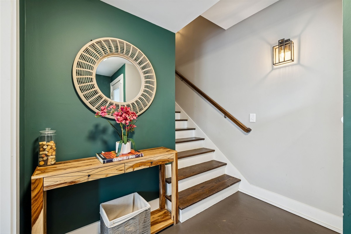 - Step into vacation mode with this vibrant entryway full of beachy charm - Hooks for your hats, totes, and sunnies make it easy to drop and go - Peek into a bold, inviting bedroom ready to recharge your energy and style