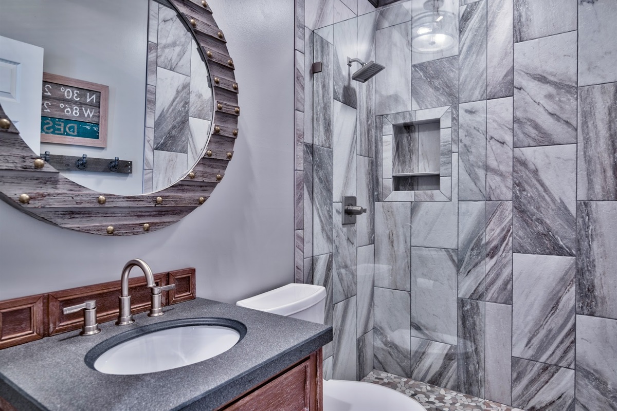 Hall shared bathroom with a walk-in shower