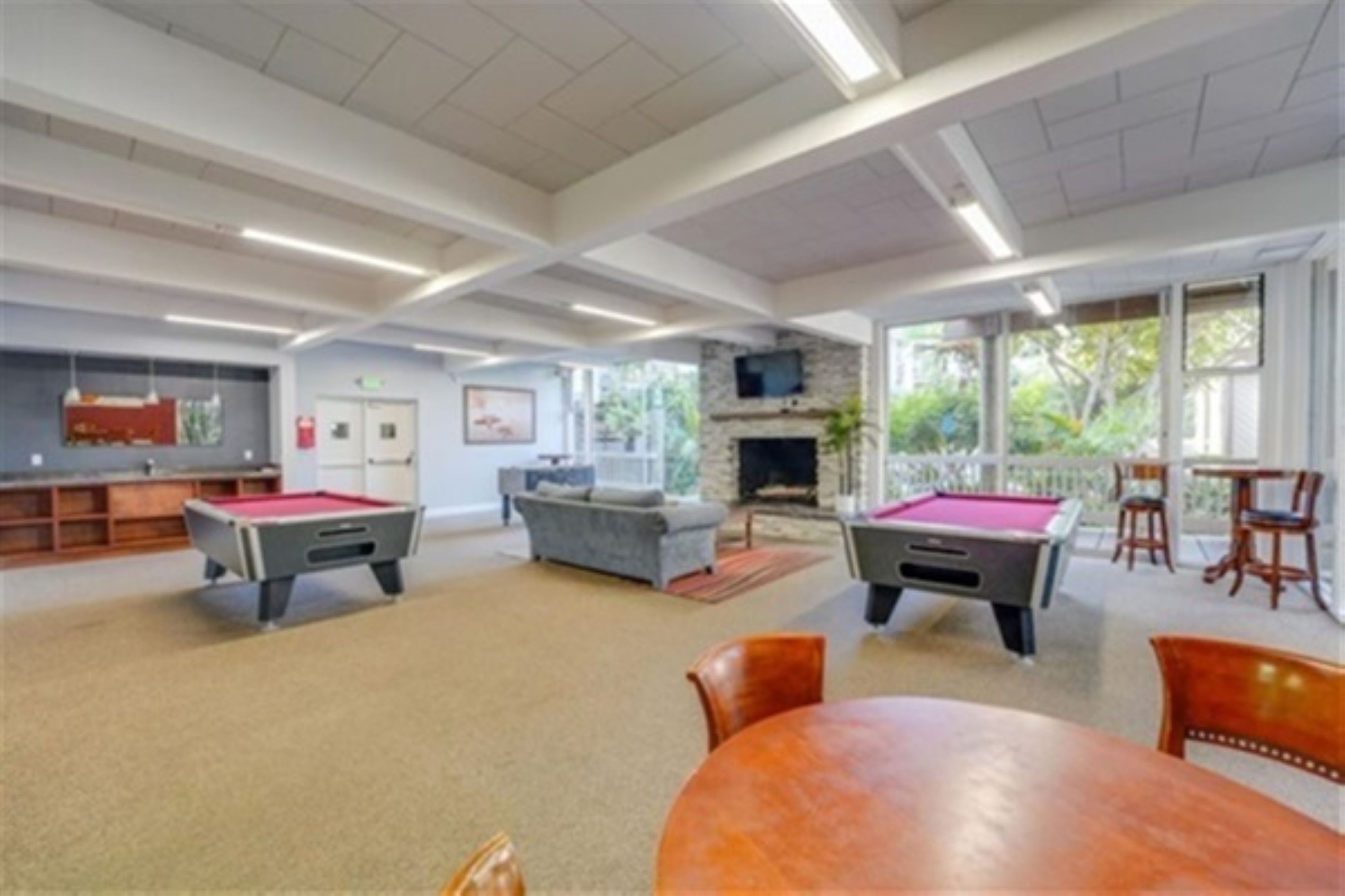 Game room with two pool tables