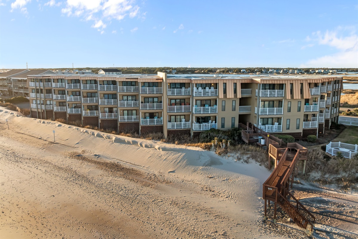 Building 1 offers private beach access via the on-site walkway, so you can step straight from the dunes onto the sand