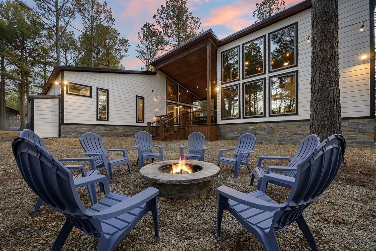Gather ‘round the firepit as the sun sets and stories begin — a perfect evening under the pines.