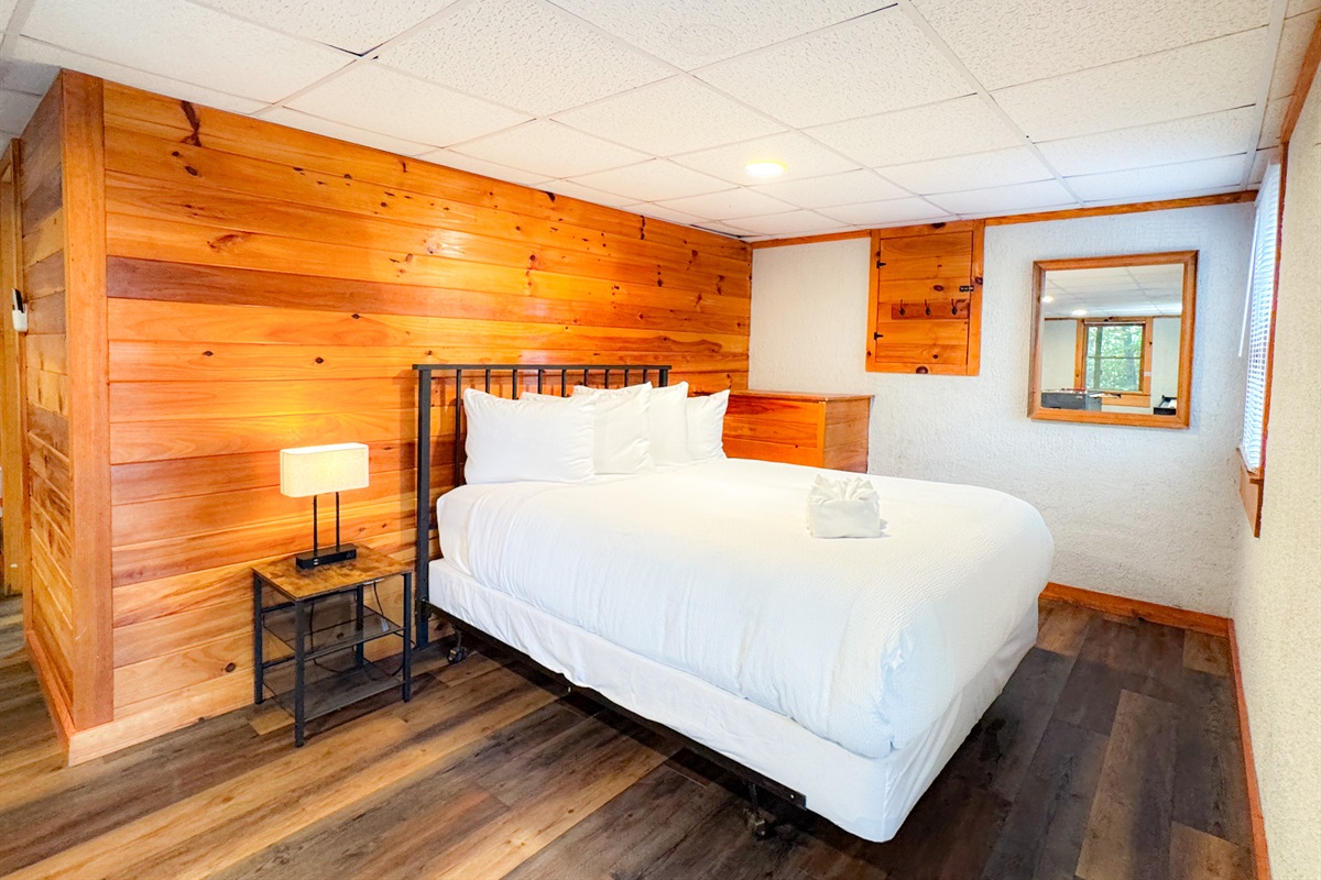 The lower level bed is open concept bedroom on the lower level game room. Please note there is no door but a partition is available for guest use if needed. 