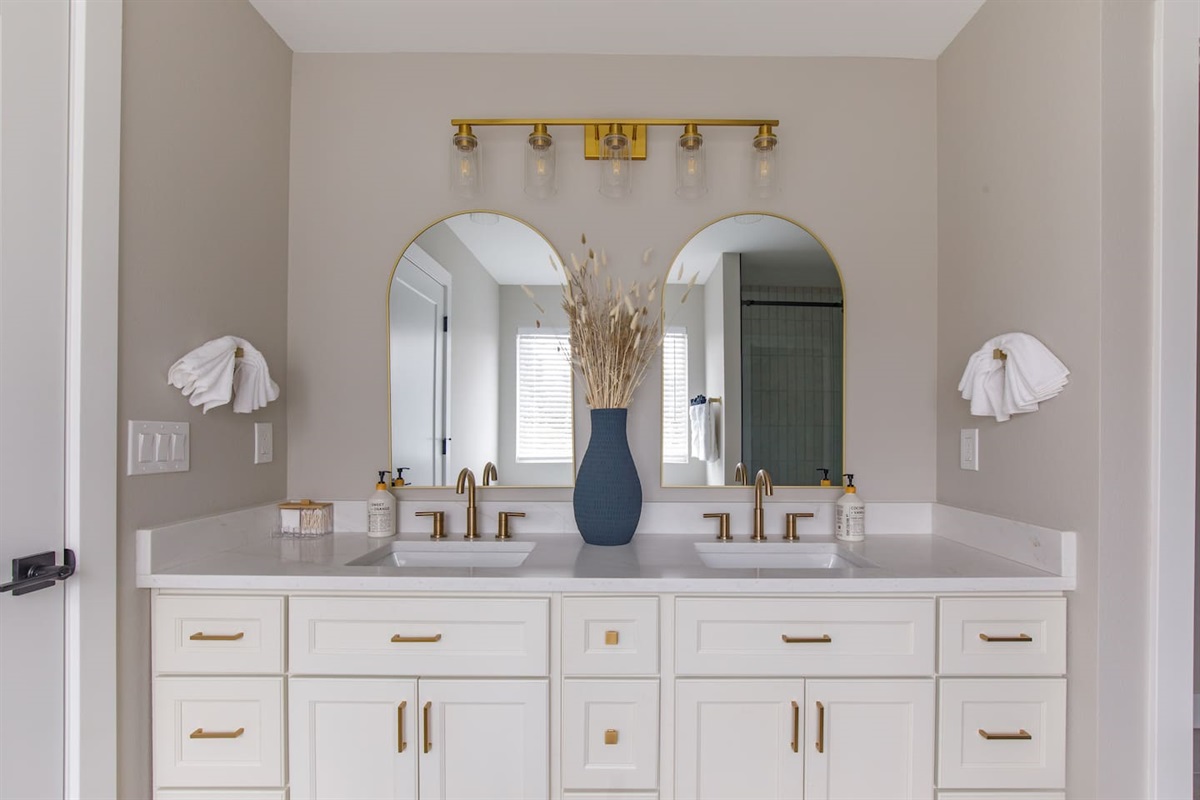 Spa inspired double vanity with elegant brass details