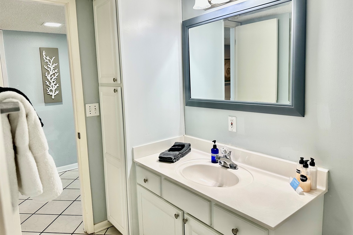 You can enter the guest bathroom from the hallway or through one of the guest bedrooms.