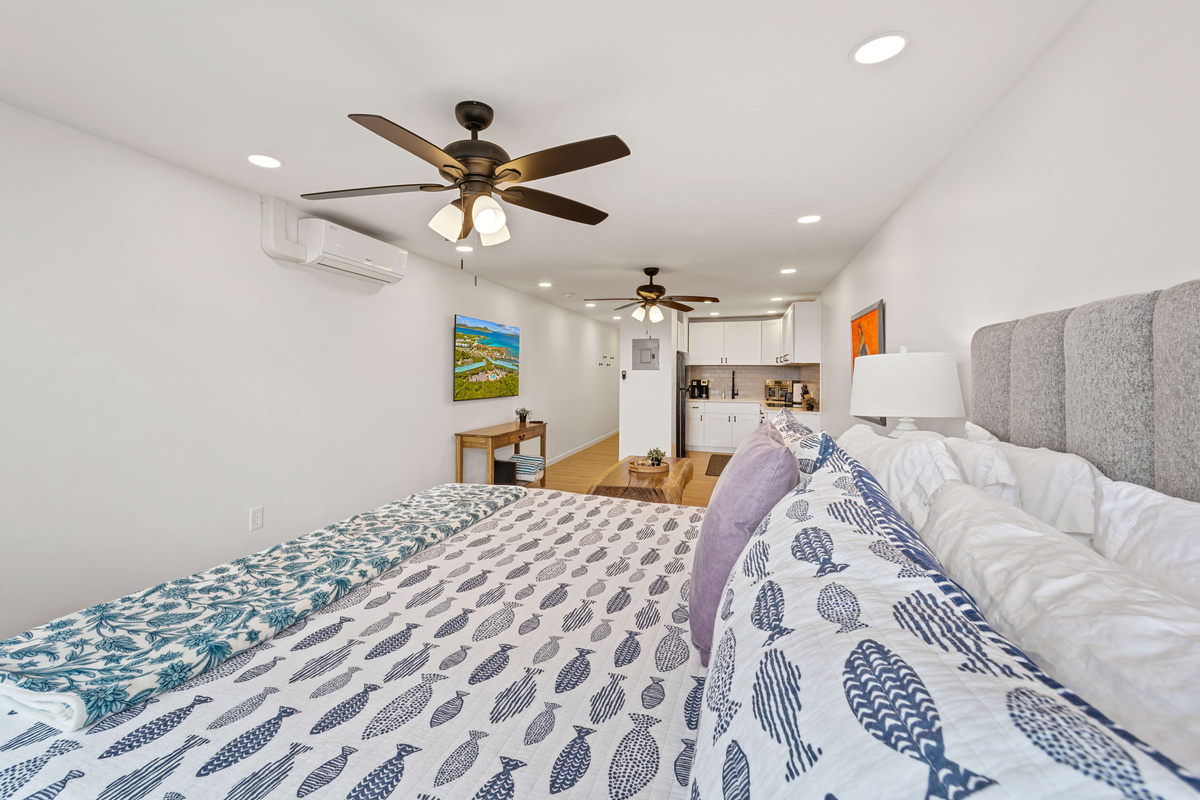Spacious simple area with a living room that has a smart flat screen TV and cable. Ceiling fans in both spaces to keep you cool