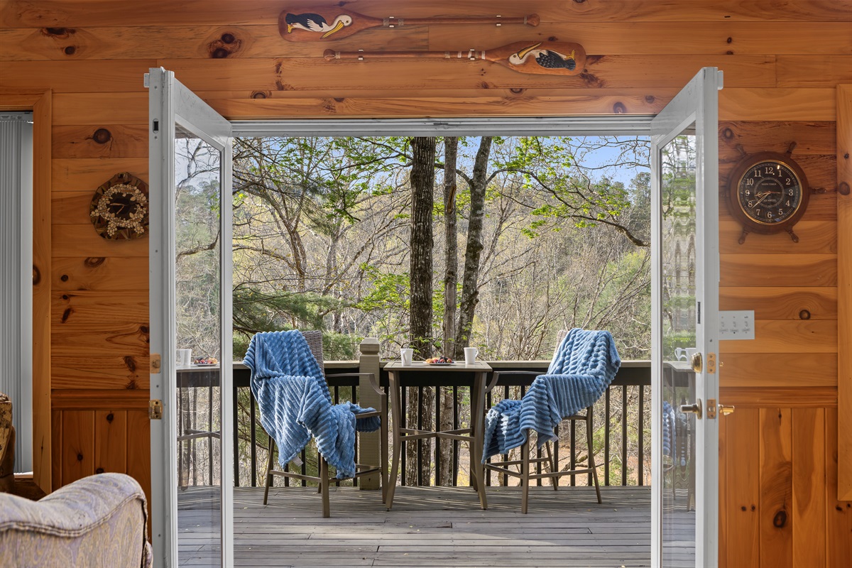 Deck: Sip morning coffee with nature views from this charming private deck!