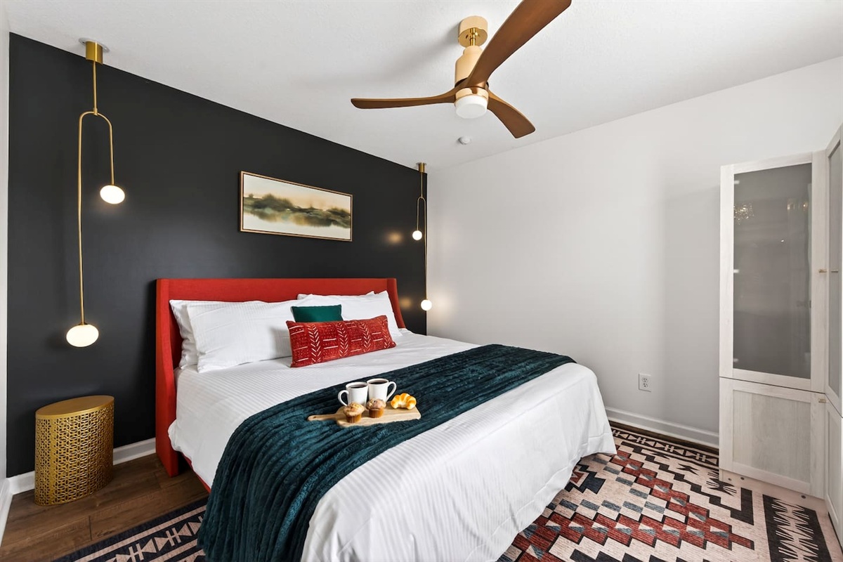 Downstairs bedroom with a King bed and a full bath across the hallway.