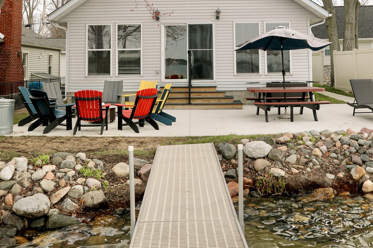 Enjoy a bonfire and nice seating by the water.