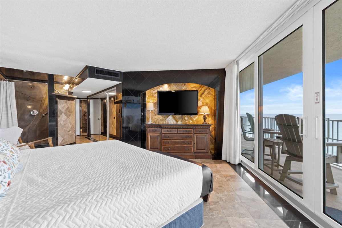Bedroom 1 with King Bed, Balcony Access, and Beach Views