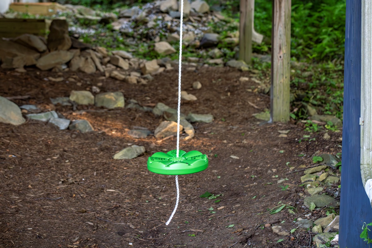 Simple disc swing under the porch—easy, classic fun for kids